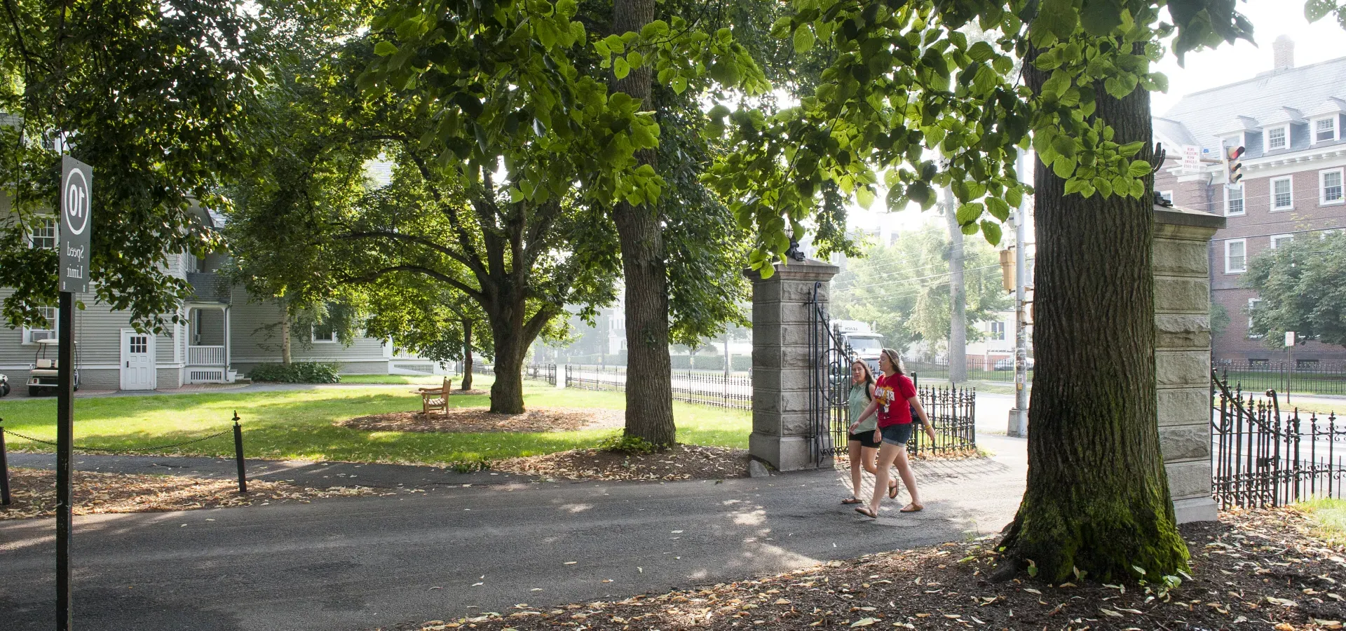 Two students walking on to campus.